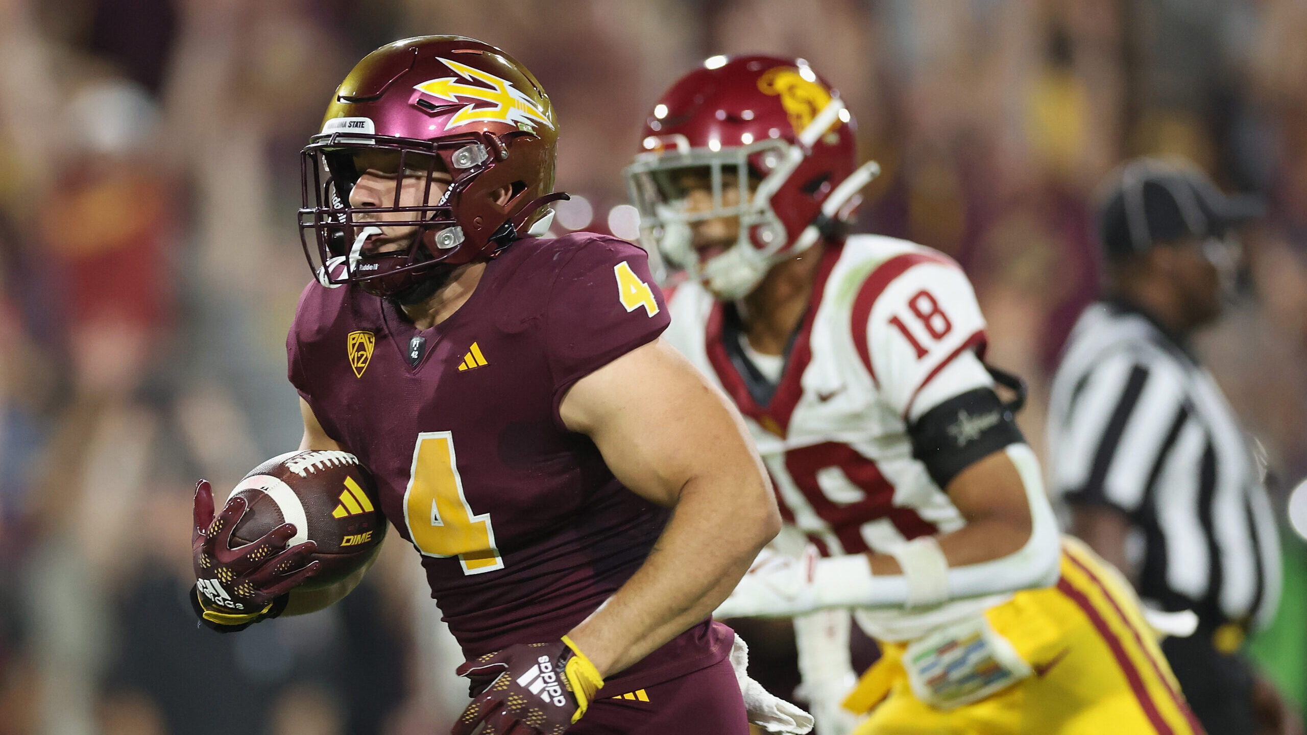 Running back Cameron Skattebo #4 of the Arizona State Sun Devils carries the football en route to s...