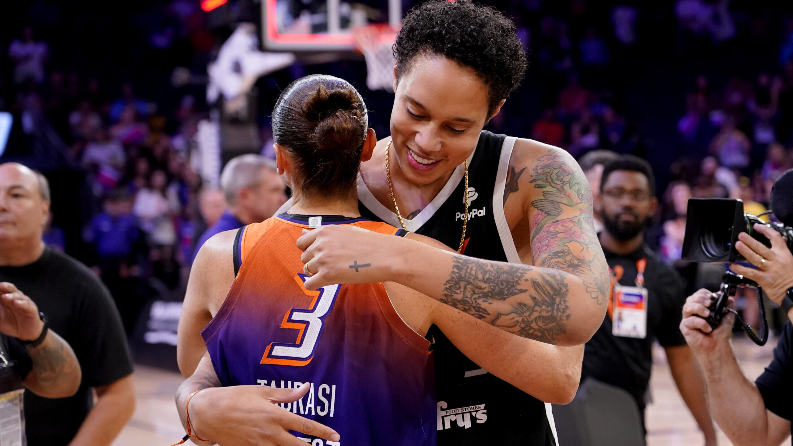 FILE - Phoenix Mercury guard Diana Taurasi (3) hugs Brittney Griner after the team's WNBA basketbal...