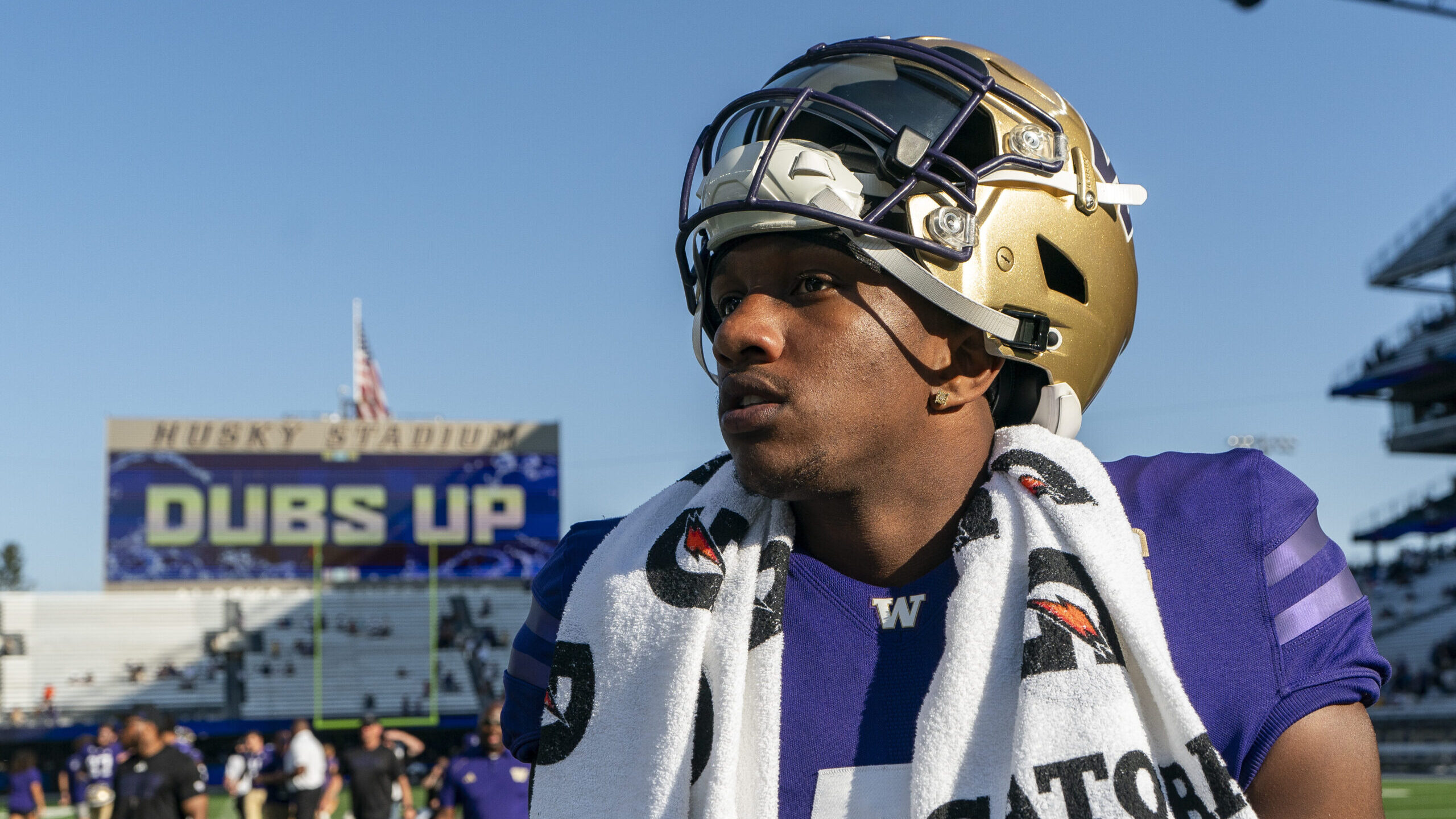 Washington quarterback Michael Penix Jr. walks on the field after a win over Tulsa in an NCAA colle...