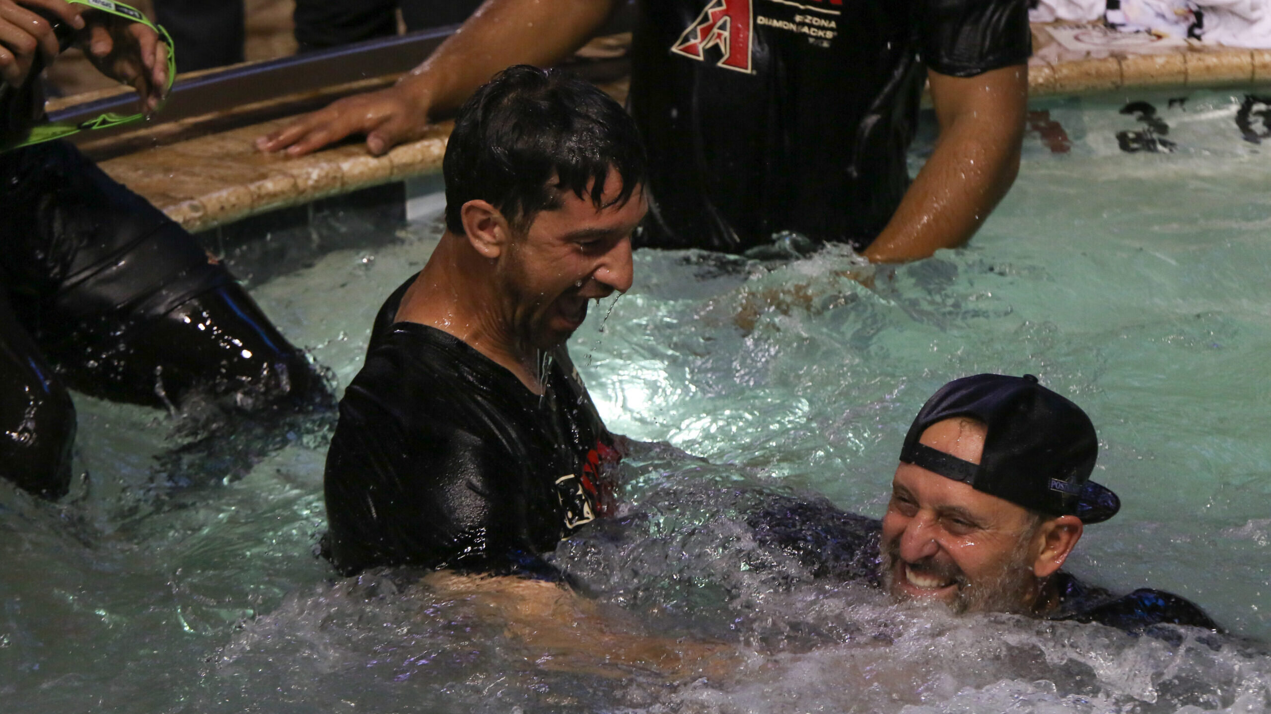 Arizona Diamondbacks manager Torey Lovullo and General Manager Mike Hazen celebrate in the Chase Fi...