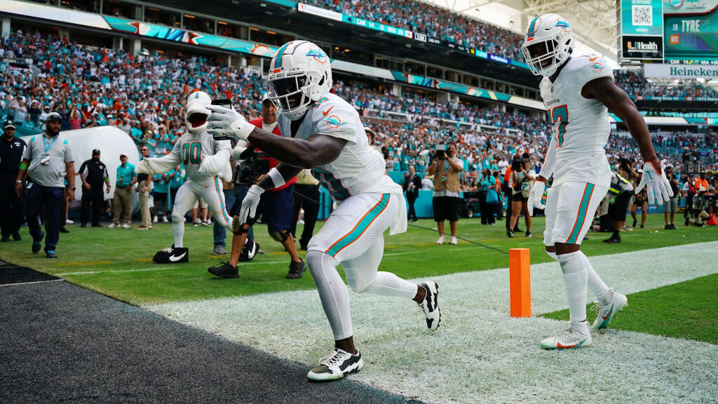 Tyreek Hill #10 of the Miami Dolphins celebrates a touchdown during the first half in the game agai...