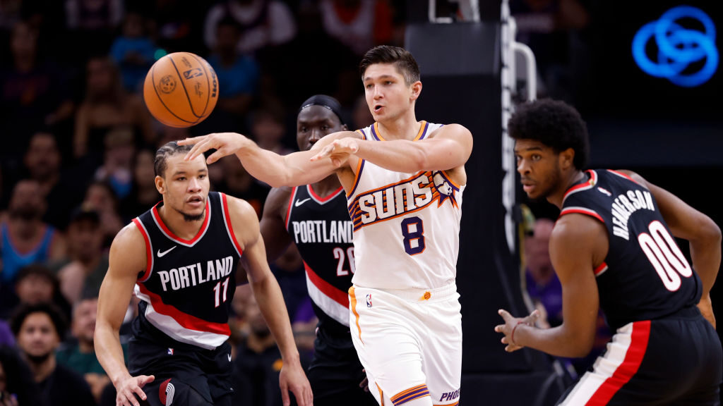 Grayson Allen #8 Phoenix Suns passes the ball during the first half against the Portland Trail Blaz...