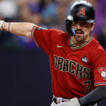 Corbin Carroll #7 of the Arizona Diamondbacks celebrates after scoring a run in the third inning against the Texas Rangers during Game One of the World Series at Globe Life Field on October 27, 2023 in Arlington, Texas. (Photo by Carmen Mandato/Getty Images)
