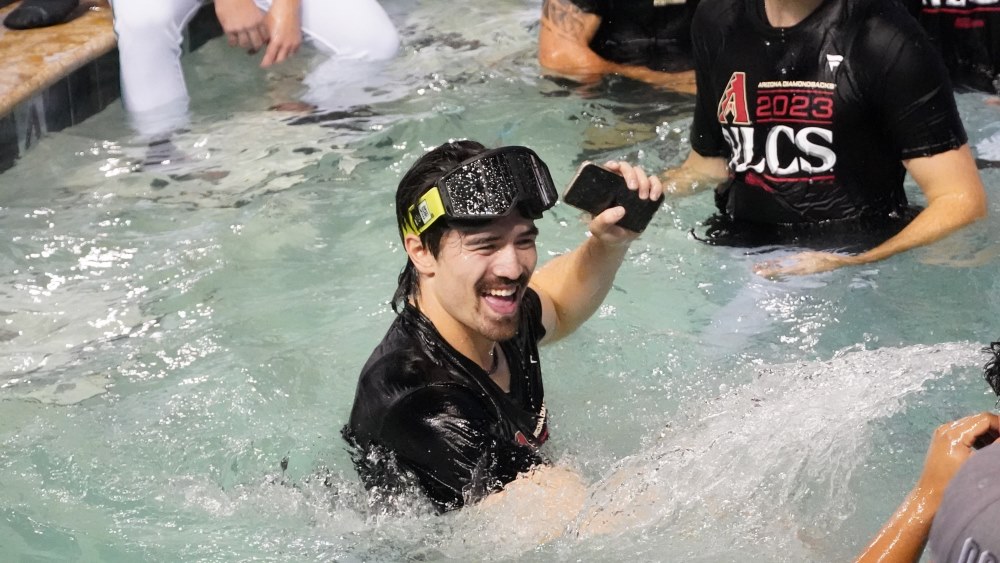 Corbin Carroll celebrates in the Chase Field pool after the Arizona Diamondbacks swept the Los Ange...