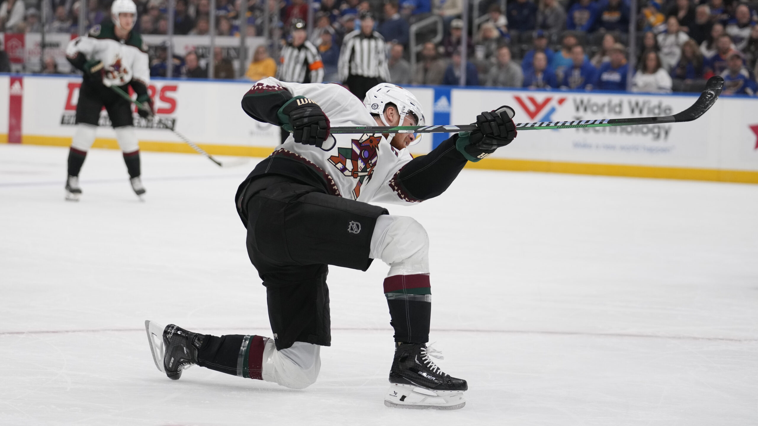 Arizona Coyotes' Lawson Crouse scores during the first period of an NHL hockey game against the St....