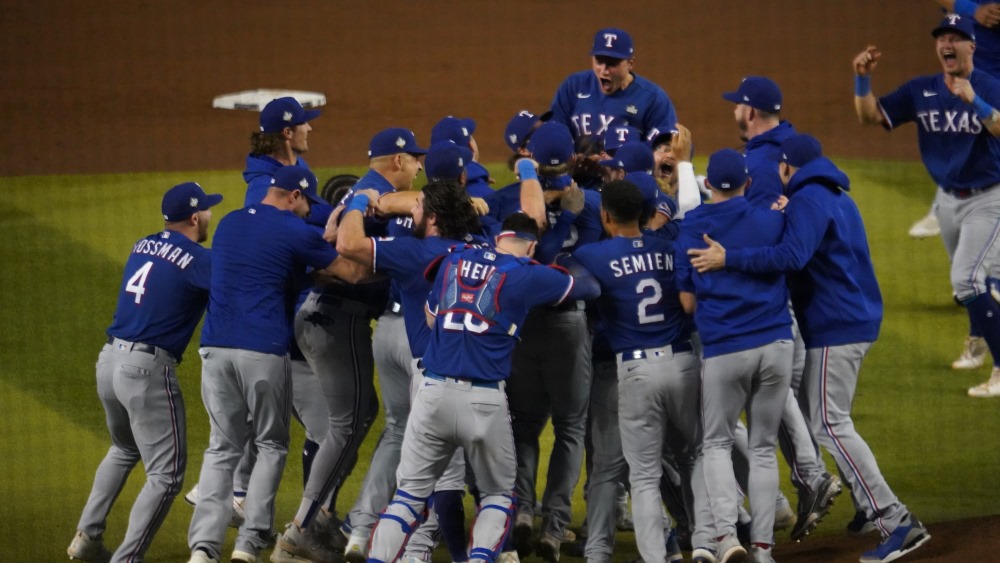The Texas Rangers celebrate after beating the Arizona Diamondbacks 5-0 in Game 5 to win the World S...