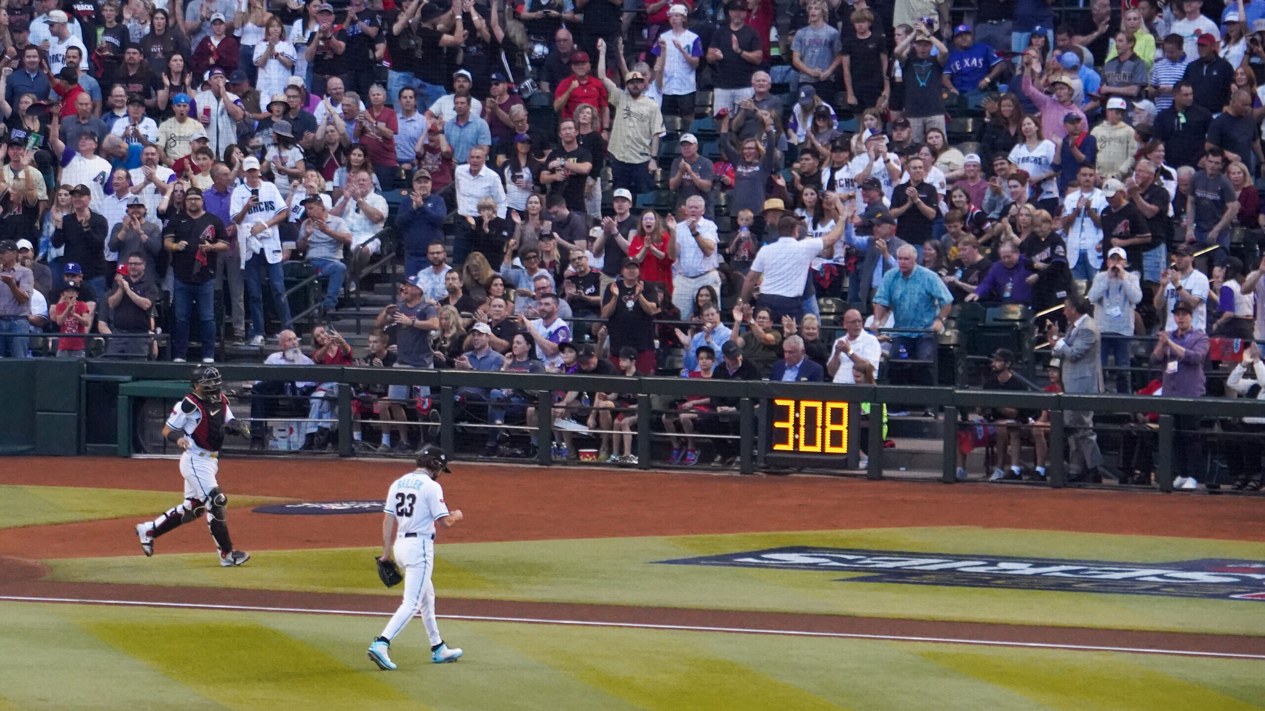 Zac Gallen of the Arizona Diamondbacks walks off the field after the first inning against the Texas...