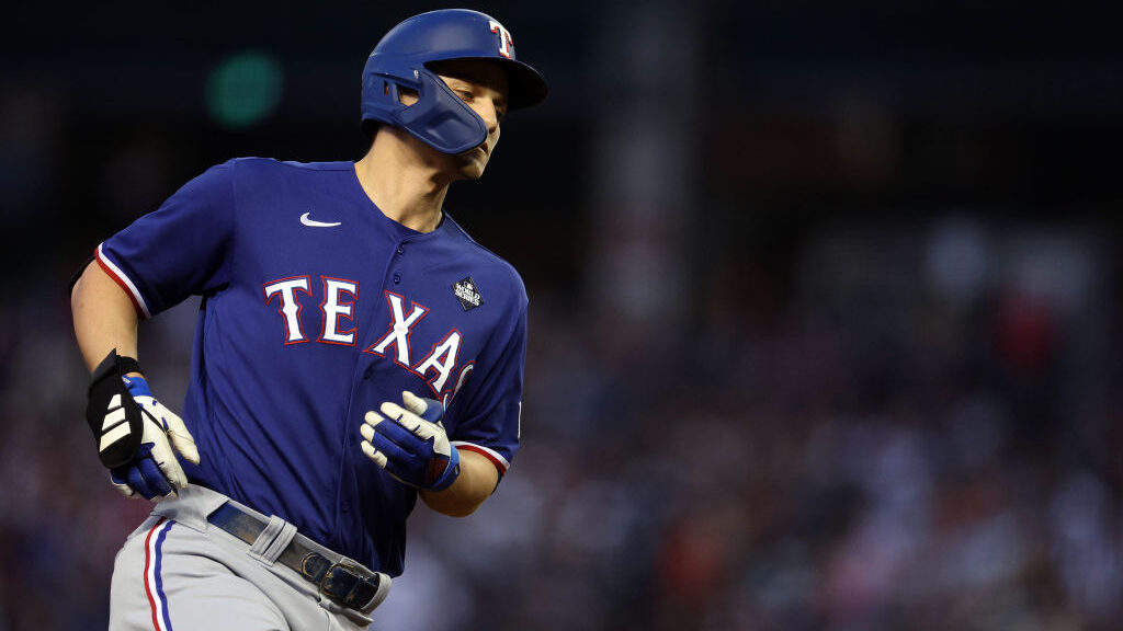 Corey Seager #5 of the Texas Rangers rounds the bases after hitting a home run in the third inning ...