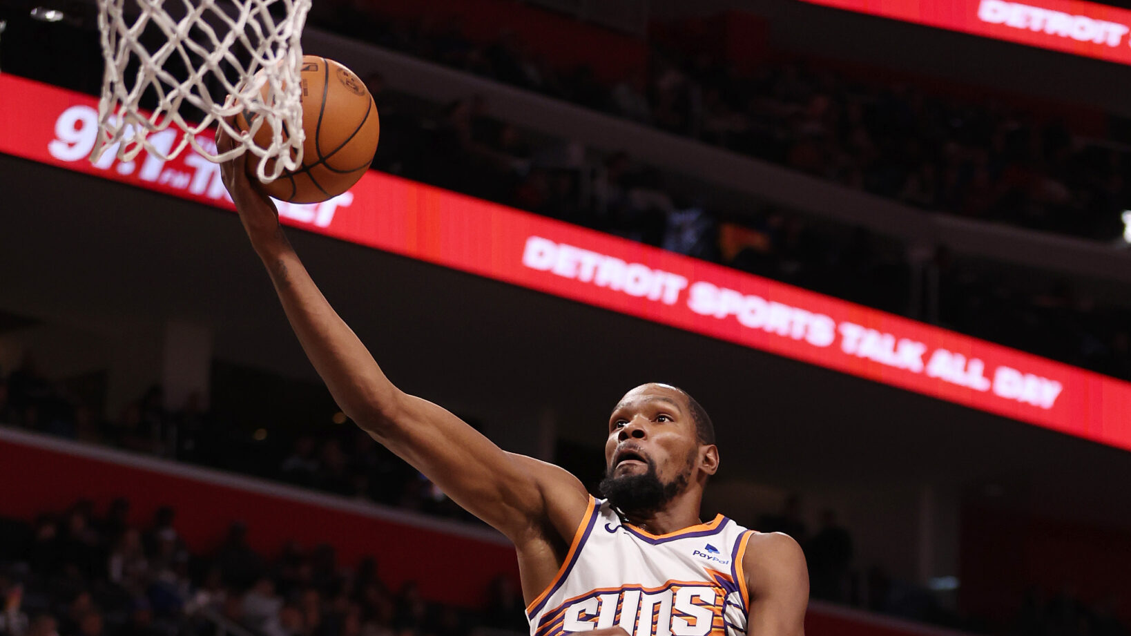 Kevin Durant #35 of the Phoenix Suns drives to the basket against Jalen Duren #0 of the Detroit Pis...