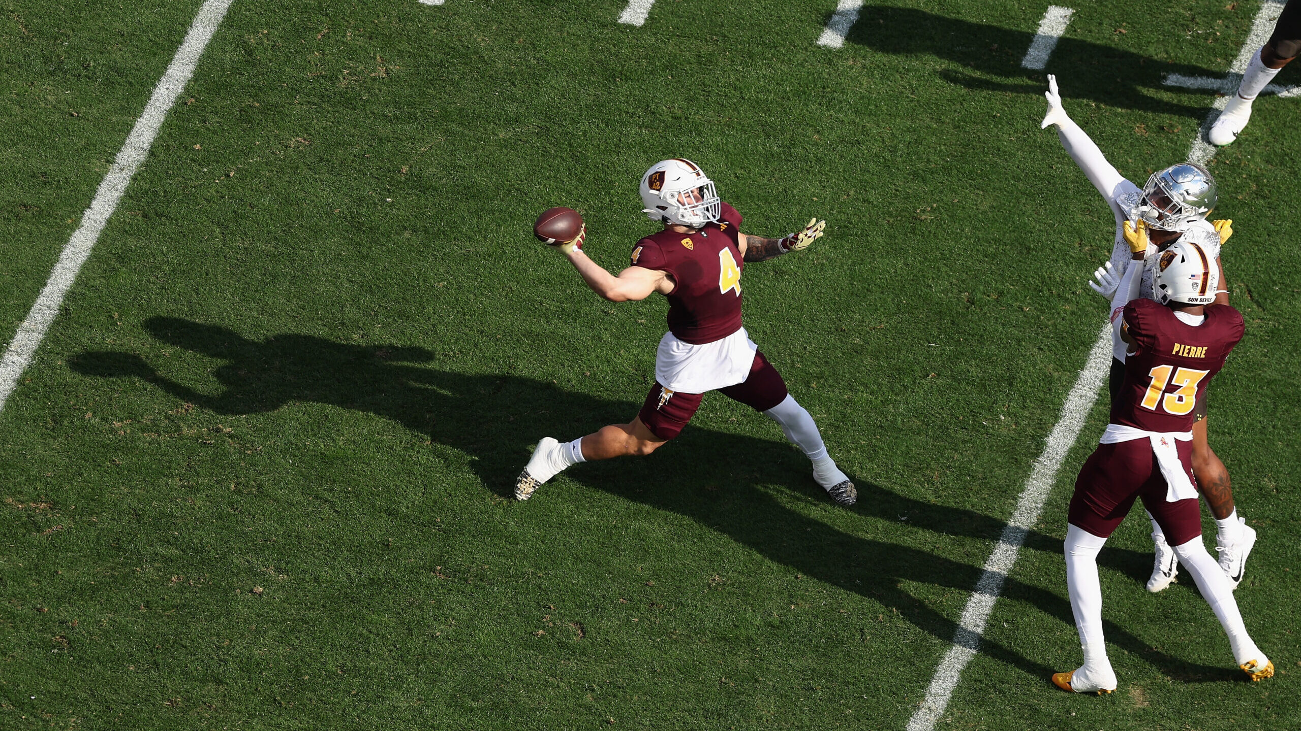 Running back Cameron Skattebo #4 of the Arizona State Sun Devils throws a pass during the first hal...