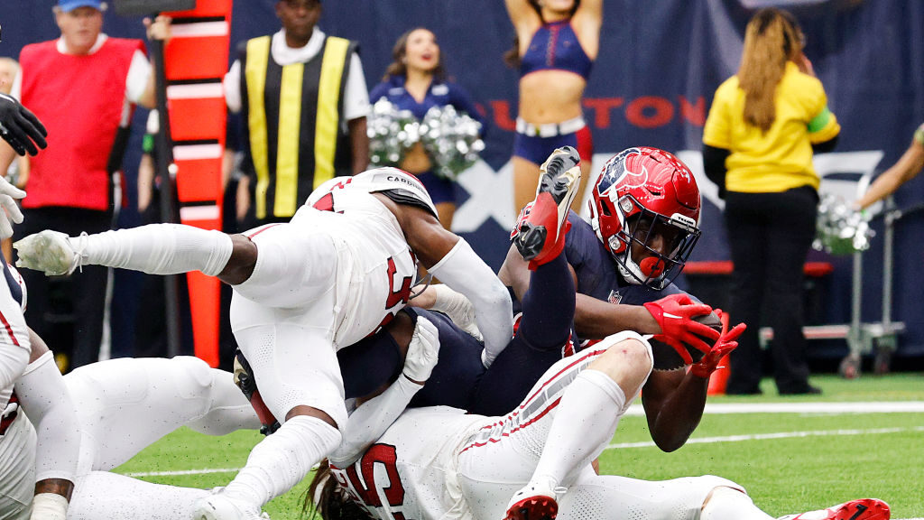 Devin Singletary #26 of the Houston Texans rolls into the end zone for a touchdown during the secon...