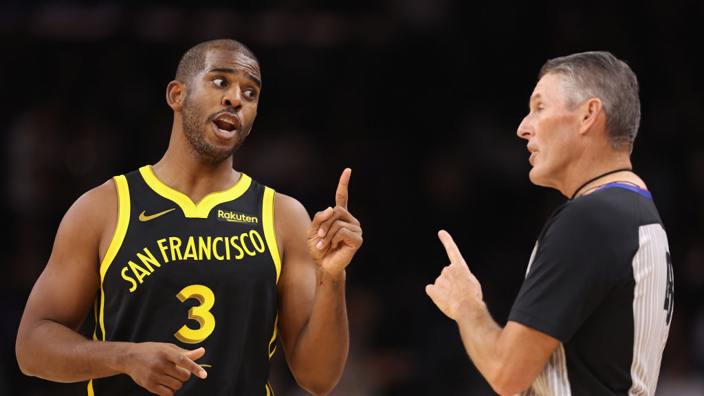 Chris Paul #3 of the Golden State Warriors reacts to referee Scott Foster #48 during the first half...