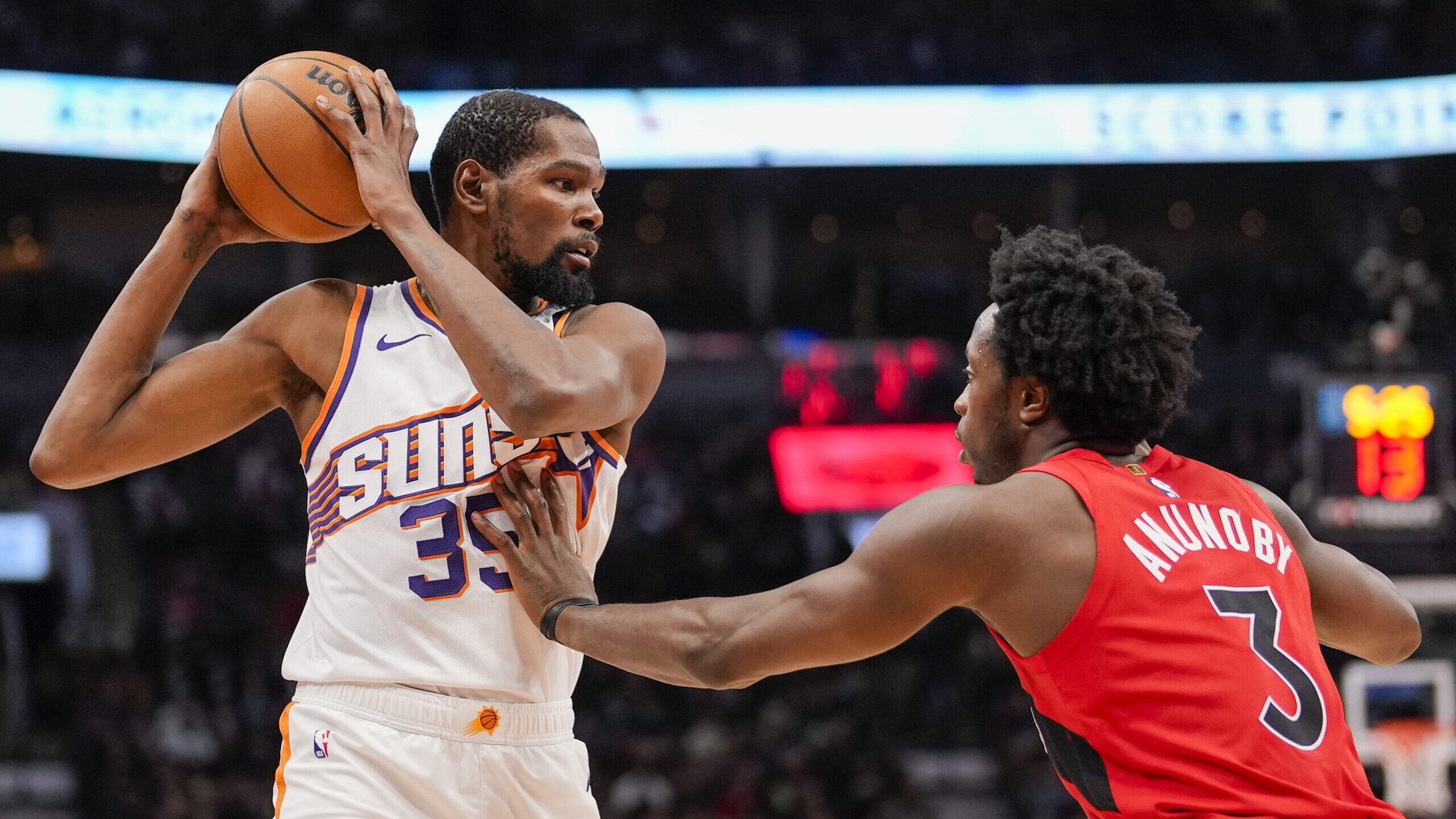 Kevin Durant #35 of the Phoenix Suns battles against O.G. Anunoby #3 of the Toronto Raptors during ...