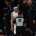 Suns guard Devin Booker talking to referee (Jeremy Schnell/Arizona Sports) 