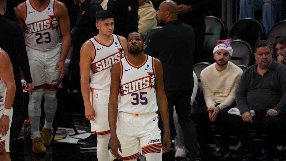 Suns forward Kevin Durant walking onto the court after a timeout (Jeremy Schnell/Arizona Sports)...
