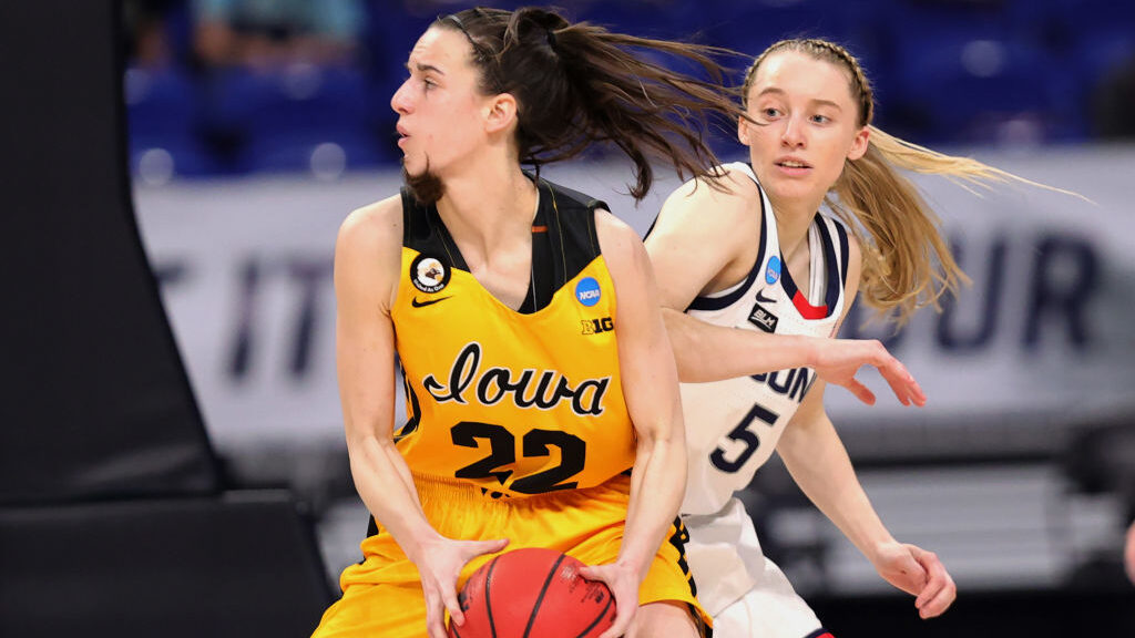 Paige Bueckers #5 of the UConn Huskies defends Caitlin Clark #22 of the Iowa Hawkeyes during the se...