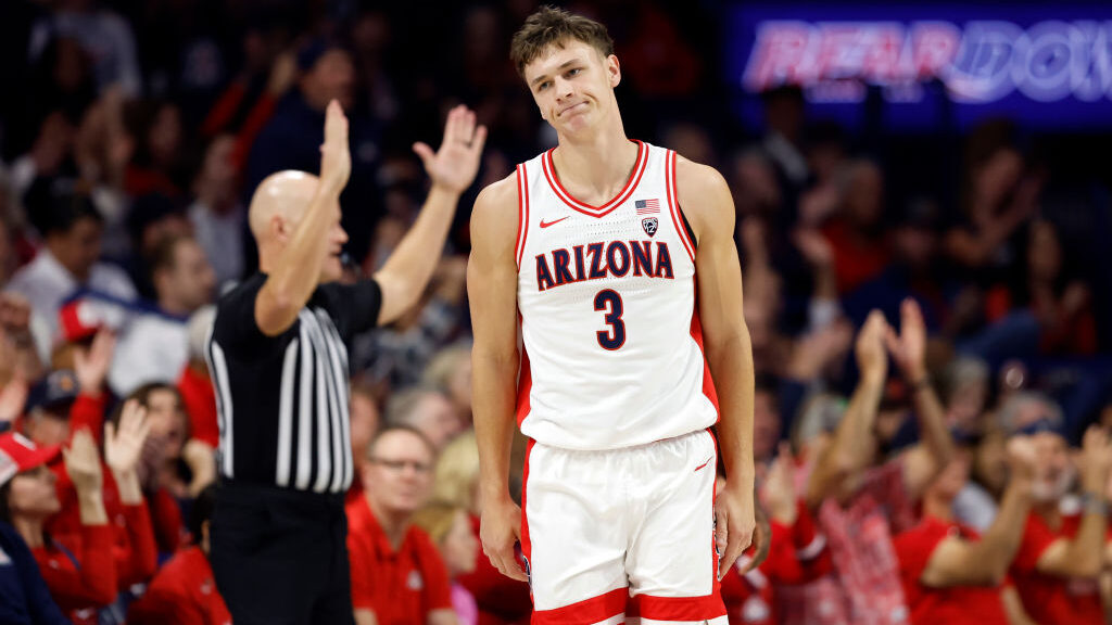 Pelle Larsson #3 of the Arizona Wildcats reacts after hitting a three point basket during the first...