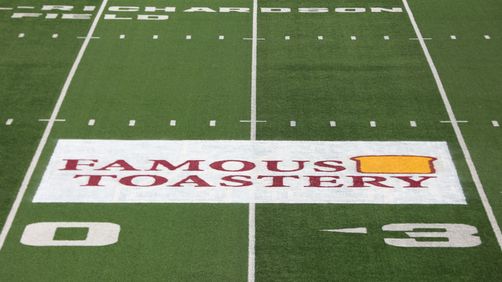 The logo for Famous Toastery is shown on the field before the Western Kentucky Hilltoppers take on ...