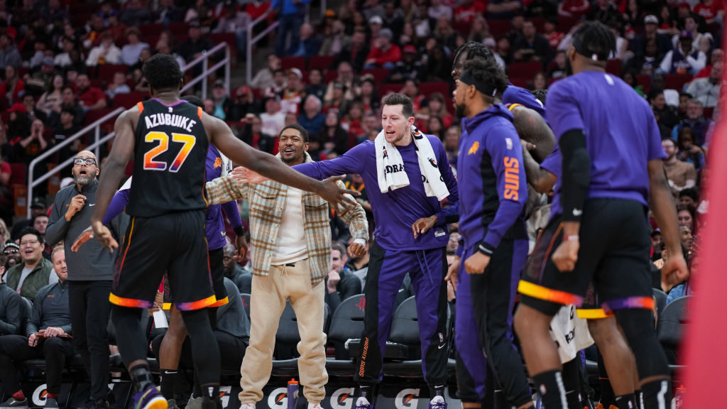 The Phoenix Suns bench reacts after Udoka Azubuike #27 of the Phoenix Suns scores during the second...