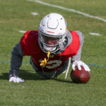 Arizona Cardinals CB Kei'Trel Clark does pushups after missing a catch during practice on Wednesday, Dec. 27, 2023, in Tempe. (Tyler Drake/Arizona Sports)