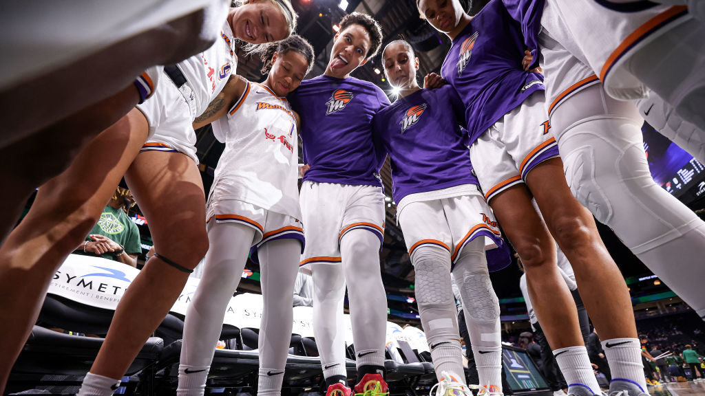 Brittney Griner #42 of the Phoenix Mercury makes a funny face as she gathers with teammates before ...