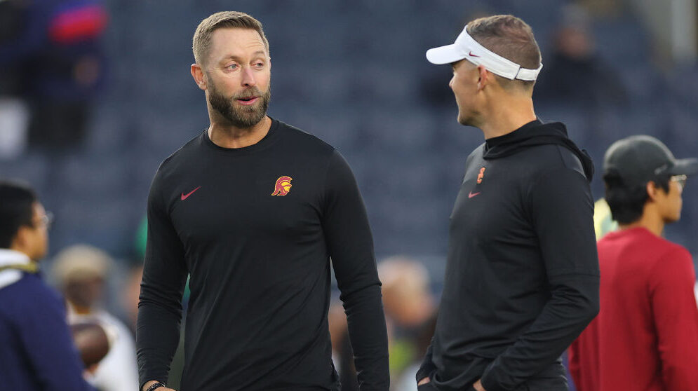Kliff Kingsbury chats with Lincoln Riley...