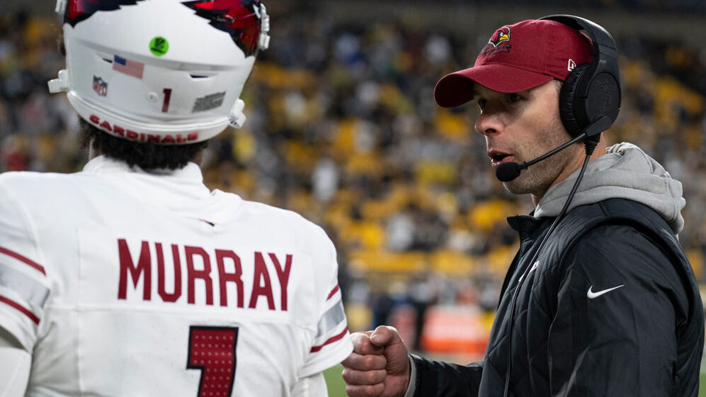 Jonathan Gannon talks with Kyler Murray during a game...