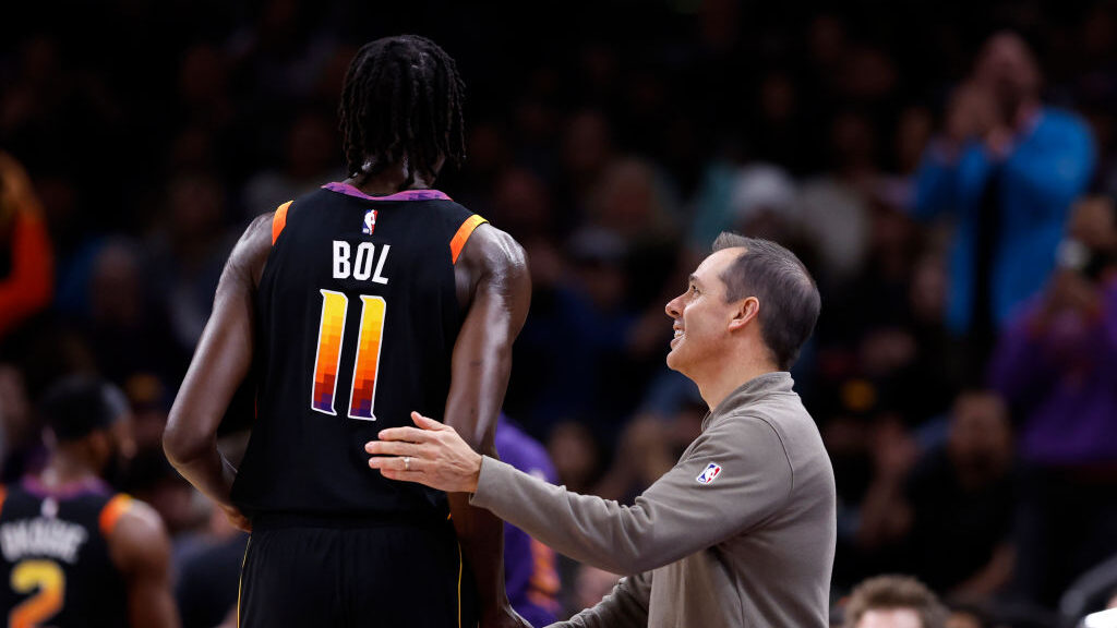 Head coach Frank Vogel of the Phoenix Suns shakes hands with Bol Bol #11 during the first half agai...