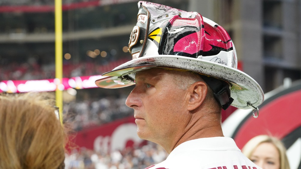 In his firefighter's helmet, Cardinals superfan Duane Schuman stands out in a crowd