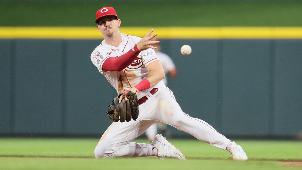 Kevin Newman #28 of the Cincinnati Reds throws the ball to first base against the Miami Marlins at ...