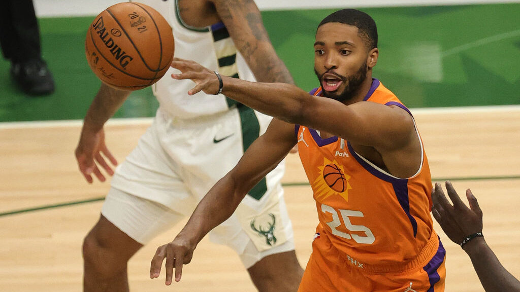 Mikal Bridges passes the ball against the Milwaukee Bucks during the first quarter in Game Four of ...