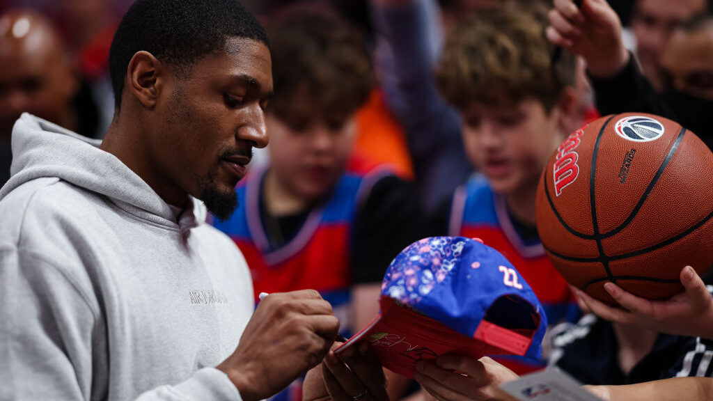 Bradley Beal #3 of the Washington Wizards signs autographs for fans after the game against the Hous...