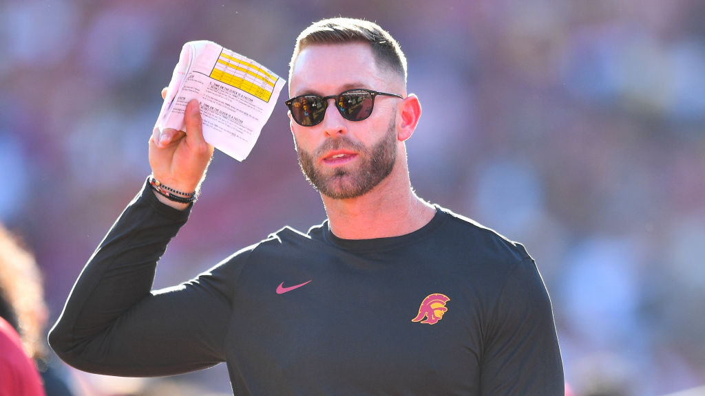 Trojans senior offensive analyst Kliff Kingsbury looks on during a game between the San Jose State ...