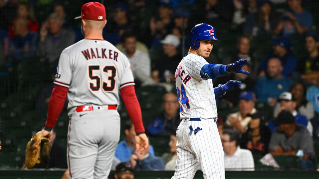 Cody Bellinger #24 of the Chicago Cubs reacts following a single during the ninth inning of a game ...