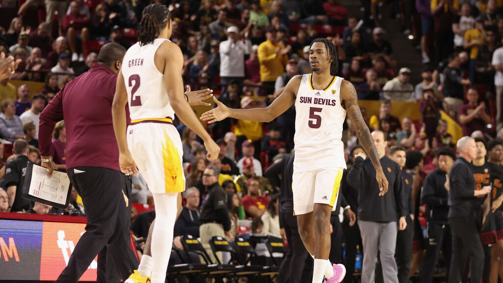 Jamiya Neal #5 of the Arizona State Sun Devils celebrates with Braelon Green #2 during the second h...