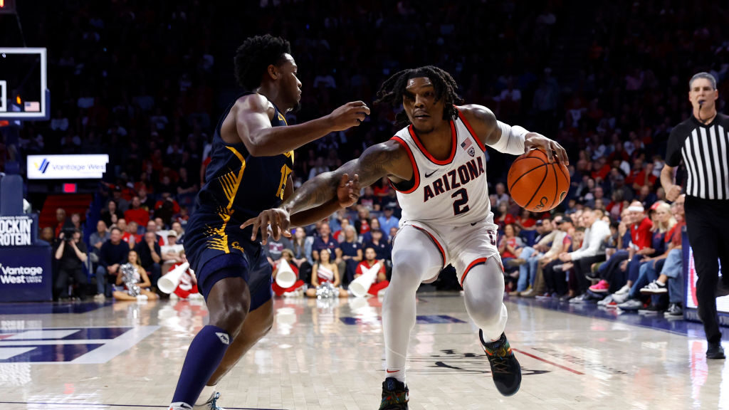 Caleb Love #2 of the Arizona Wildcats drives against Jalen Cone #15 of the California Golden Bears ...