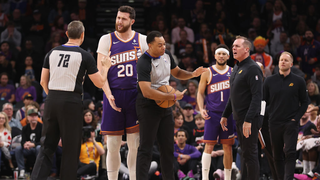 Head coach Frank Vogel and Jusuf Nurkic #20 of the Phoenix Suns react to referees J.T. Orr #72 and ...