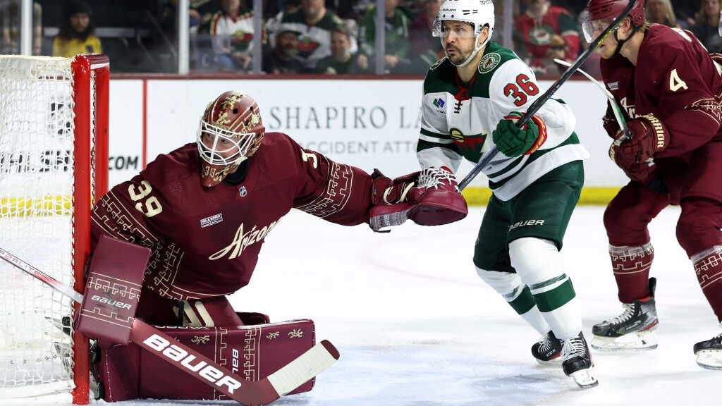 Mats Zuccarello #36 of the Minnesota Wild skates for a loose puck against Connor Ingram #39 of the ...