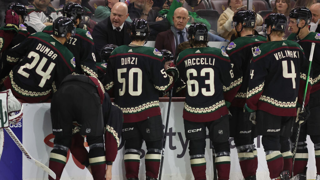 Head coach Andre Tourigny of the Arizona Coyotes talks with his team during a third period timeout ...