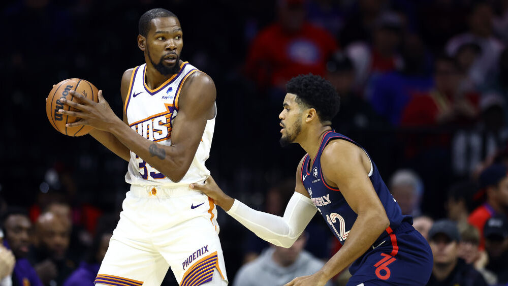 Suns star Kevin Durant posts up Tobias Harris of the 76ers...