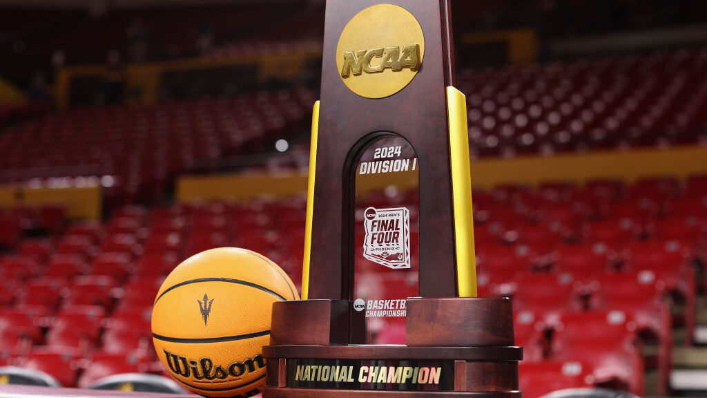 The NCAA men's basketball championship trophy is displayed before the game between the Arizona Stat...