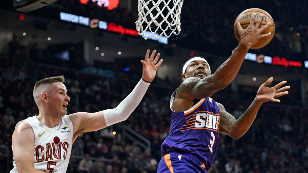 Bradley Beal #3 of the Phoenix Suns shoots against Sam Merrill #5 of the Cleveland Cavaliers during...
