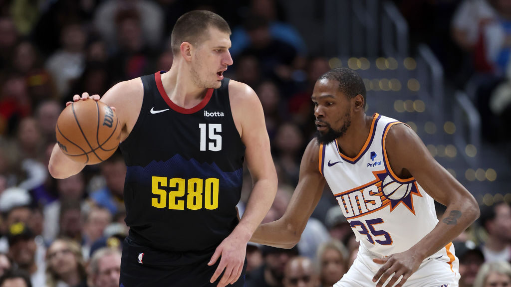 Nikola Jokic #15 of the Denver Nuggets is guarded by Kevin Durant #35 of the Phoenix Suns during th...