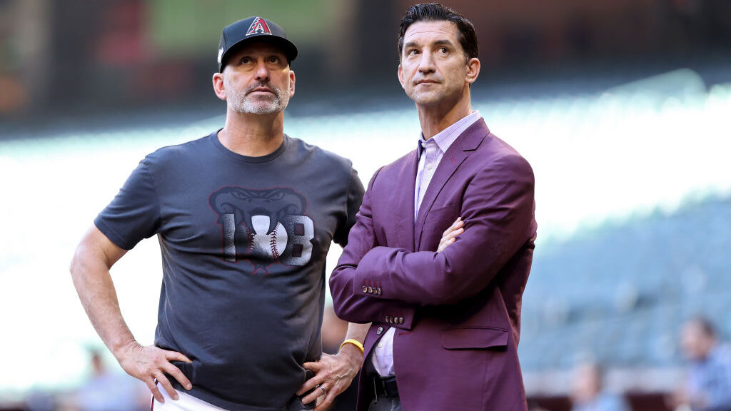 Manager Torey Lovullo (L) and general manager Mike Hazen of the Arizona Diamondbacks meet before Ga...