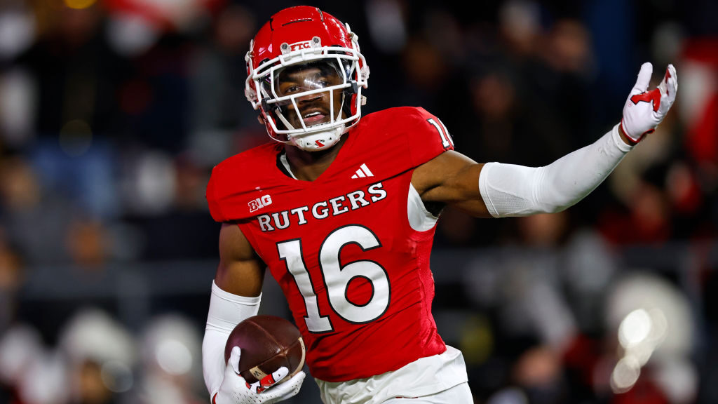 Defensive back Max Melton #16 of the Rutgers Scarlet Knights celebrates his interception against th...
