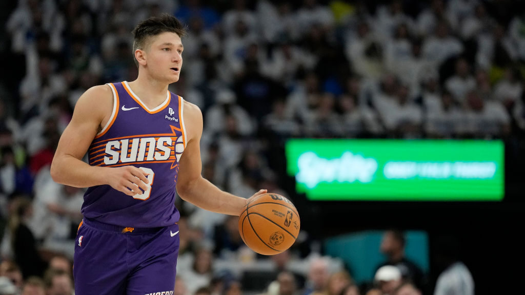 Grayson Allen #8 of the Phoenix Suns dribbles the ball during the second half in game one of the We...