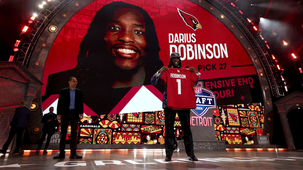 Darius Robinson poses after being selected 27th overall by the Arizona Cardinals during the first r...