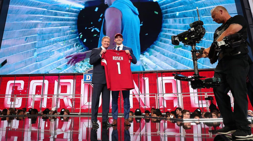 Josh Rosen poses with a Cardinals jersey after getting drafted