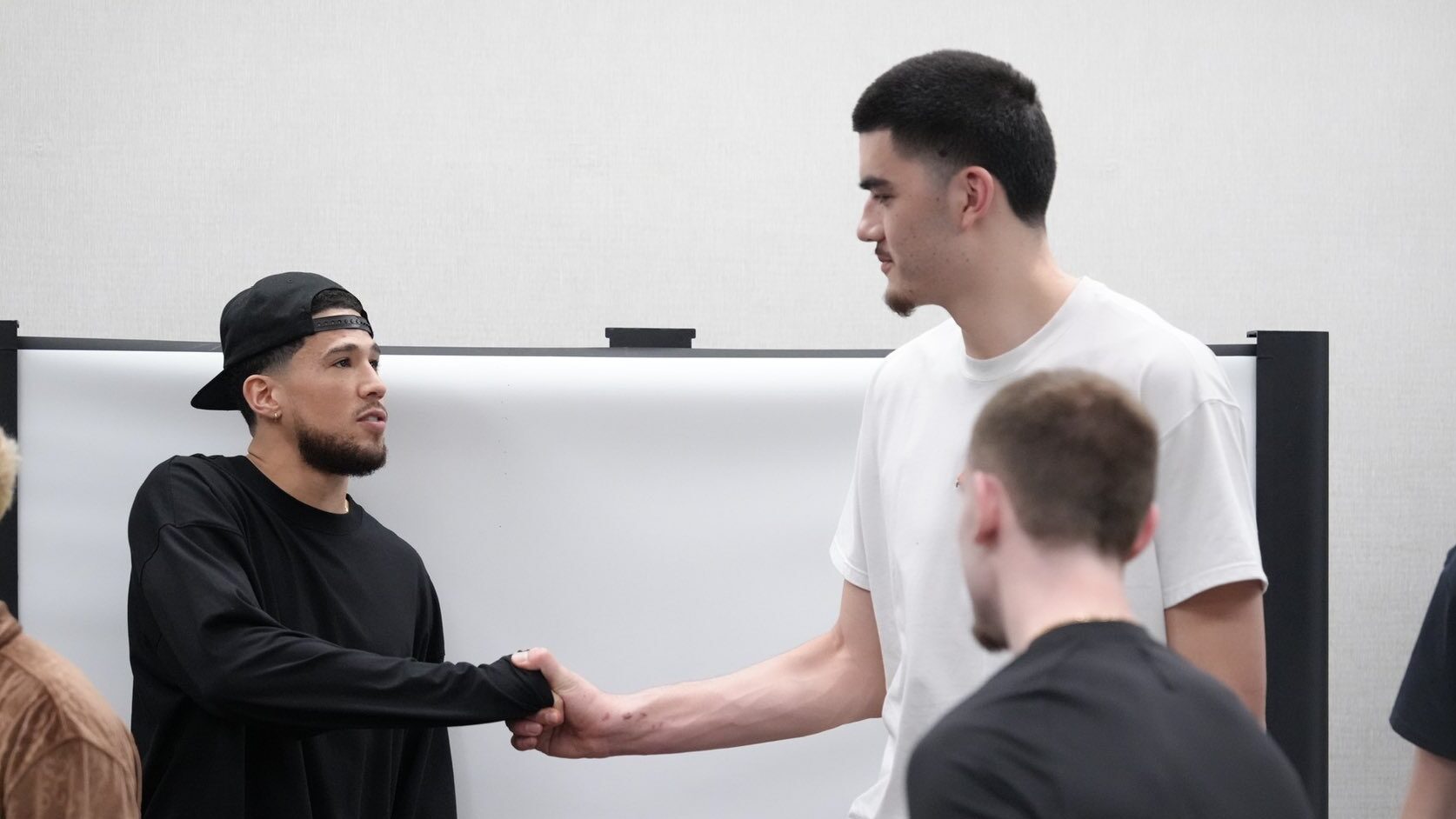 Devin Booker gifts Purdue men's basketball with Book 1s...