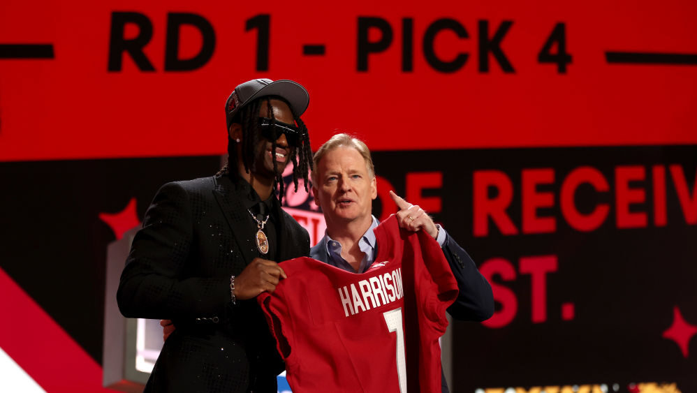 Marvin Harrison Jr. poses with NFL Commissioner Roger Goodell after being selected fourth overall b...